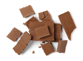 Chocolate pieces, bars isolated on white background, top view