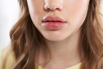 Lovely teen girl demonstrating her beautiful full lips