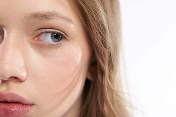 Obraz premium Lovely teen girl with perfect skin looking away with serious expression