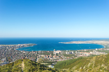 Fototapeta na wymiar Aerial view of Gelendzhik sea bay. Photo of resort city from hill of caucasian mountains.