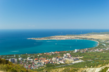 Fototapeta na wymiar Aerial view of Gelendzhik city and sea bay. Photo of popular resort from hill of caucasian mountains.