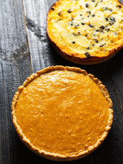 Two autumnal pie. Homemade cake. Traditional pumpkin pie for thanksgiving and pumpkin casserole