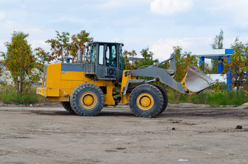 backhoe to excavate the soil on the ground.construction site excavator.wheel loader.