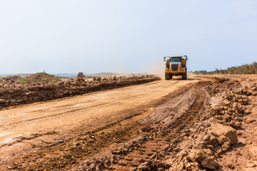 Industrial Dump Truck Vehicle Moving Earth Property Development Countryside Landscape.
