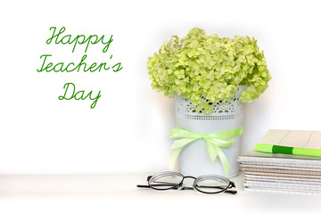 Happy Teacher's day greeting card - bouquet of light green hydrangea branch in flower pot with...