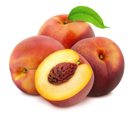 Heap of whole and halved nectarines with leaves isolated on white background. As design element.