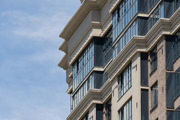 Stained glass loggias with stucco elements. A new Renaissance architecture residential building.