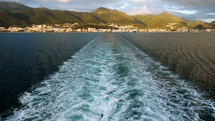 Trail on water from boat floating in Mediterranean sea. Greece. 4K