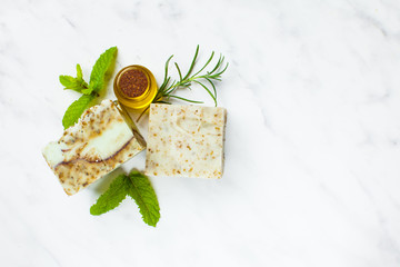 Homemade soaps. Variety of colorful handmade soap bars on wooden background