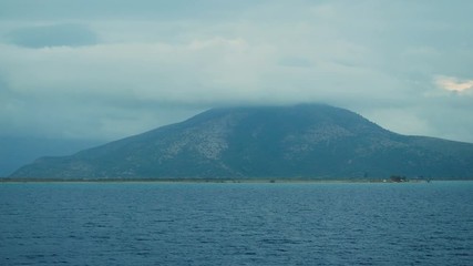 Mountain top in the cloud. Beautiful view of the greek island with rock in the Ionian sea. Nature of Greece. 4K