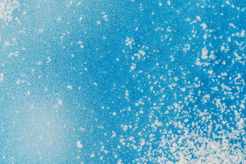 Winter icy blue background with snow, copy space