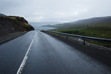 A long winding coastal road on a cold grey winter's day.