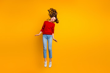 Full size photo of cute lady jumping high wear knitted sweater isolated yellow background