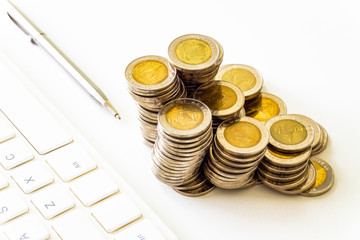 Coins stacked on each other in different positions. Saving money and finance business concept. Business finance and save money for prepare in the future. Time is money concept.