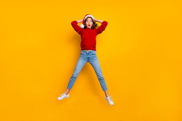 Fototapeta na wymiar Full length photo of funky lady jumping high to see shock news wear knitted sweater isolated yellow background