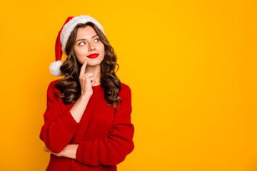 Photo of amazing lady dreamy look empty space wear knitted jumper and santa hat isolated yellow...