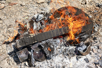 tin can in the fire, garbage after tourists. Environmental pollution by waste. burnt pile of trash. Ecological problems.