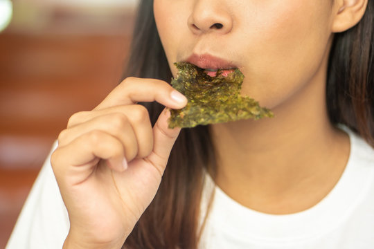 Woman Eating Dry Seaweed, Concept Of Woman On Diet, Healthy Eating, Healthy Diet Lifestyle