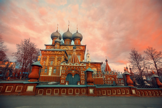 beautiful Church in pink sunset. Image with selective focus. noise effect