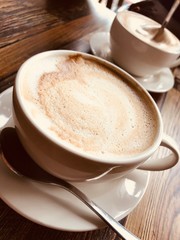 Fototapeta premium coffee cup on wooden table