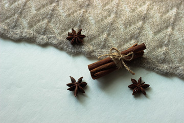 star anise and cinnamon sticks on wooden background