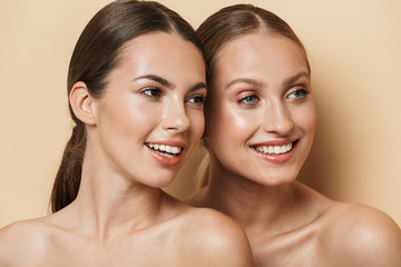 Optimistic beautiful blonde and brunette women.