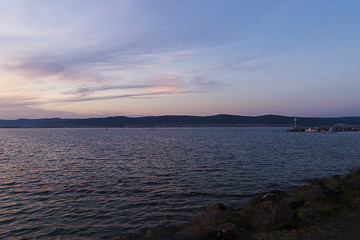 Obraz premium Twilight on the Black Sea coast. Mountains in the distance