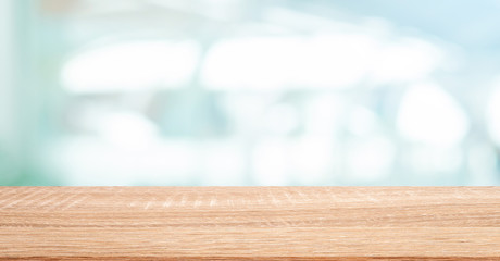 abstract blurred modern interior bathroom background with brown wood tabletop for show,ads,design product on display concept