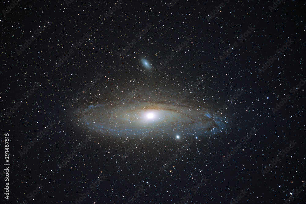 Wall mural m31 the andromeda galaxy glowing in the clear starry night sky, cornwall, uk