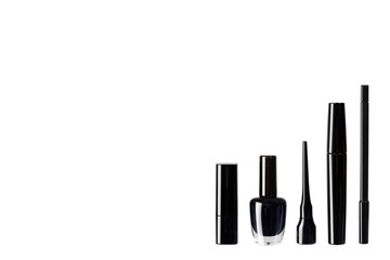 Black mascara, nail polish and lipstick, eye makeup brush.