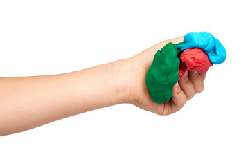 Children hand with color plasticine, kids educational toy.
