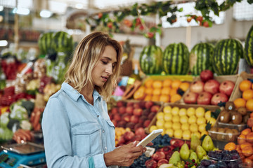 Calm woman with notebook at the market stock photo