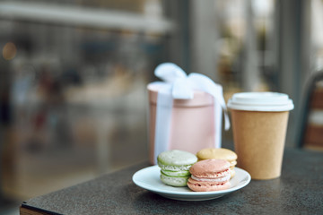 Cookies present and coffee to go on the table stock photo