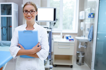 Cheerful general practitioner at work stock photo