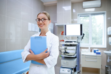 Happy woman enjoying work in hospital stock photo