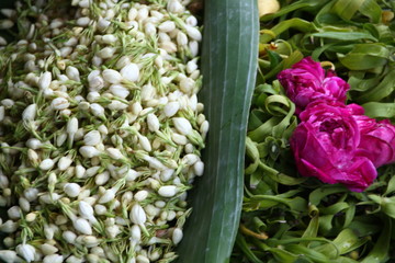 selling various colorful flowers on the street market for religious ceremonies or decorations, 
