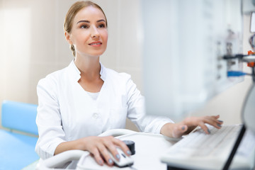Obraz na płótnie Canvas Female doctor working with computer stock photo