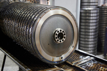 stacked steel pulleys inside factory