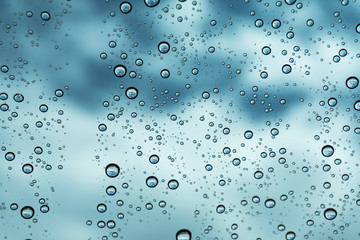 Rain on the window, natural skin of the rain The natural form of rainwater on a sky background.