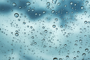 Rain on the window, natural skin of the rain The natural form of rainwater on a sky background.