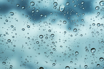 Rain on the window, natural skin of the rain The natural form of rainwater on a sky background.