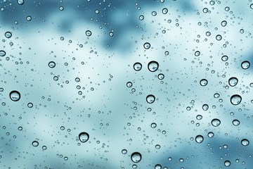 Rain on the window, natural skin of the rain The natural form of rainwater on a sky background.