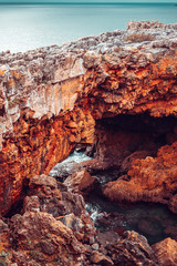Stone bridge made of cliffs near the ocean