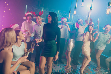 Nice attractive well-dressed elegant trendy stylish fashionable cheerful cheery positive ladies and guys gentlemen having fun chill out lifestyle at modern luxury fogged lights nightclub