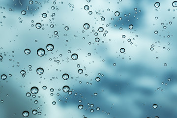 Rain on the window, natural skin of the rain The natural form of rainwater on a sky background.