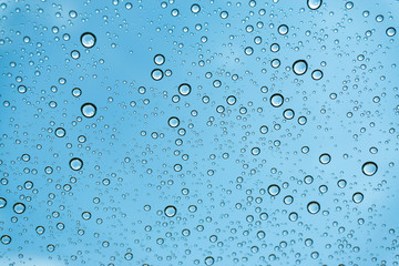 Rain on the window, natural skin of the rain The natural form of rainwater on a sky background.