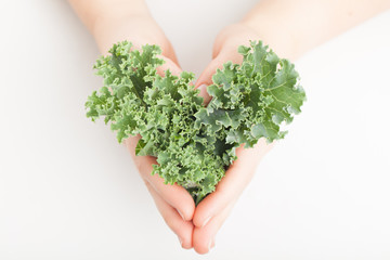 Kale Leaves in the shape of a heart - copy space