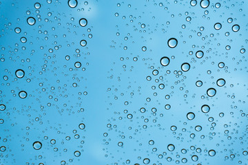 Rain on the window, natural skin of the rain The natural form of rainwater on a sky background.