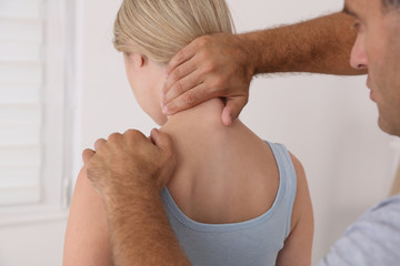 Chiropractic / Osteopathy treatment, Back pain relief. Physiotherapy for female patient, sport injury recovery , Kinesiology