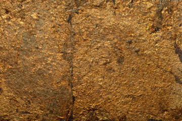 Fake gold yellow texture abstract wall background and gradients shadow shiny